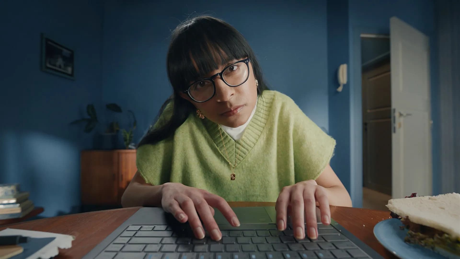 A girl typing on her laptop.