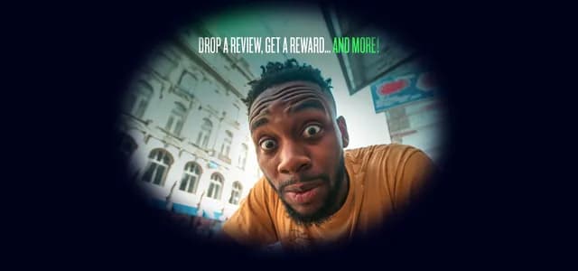 Surprised man on a city street with TADAAM Drops the Mic campaign text about reviews and rewards.