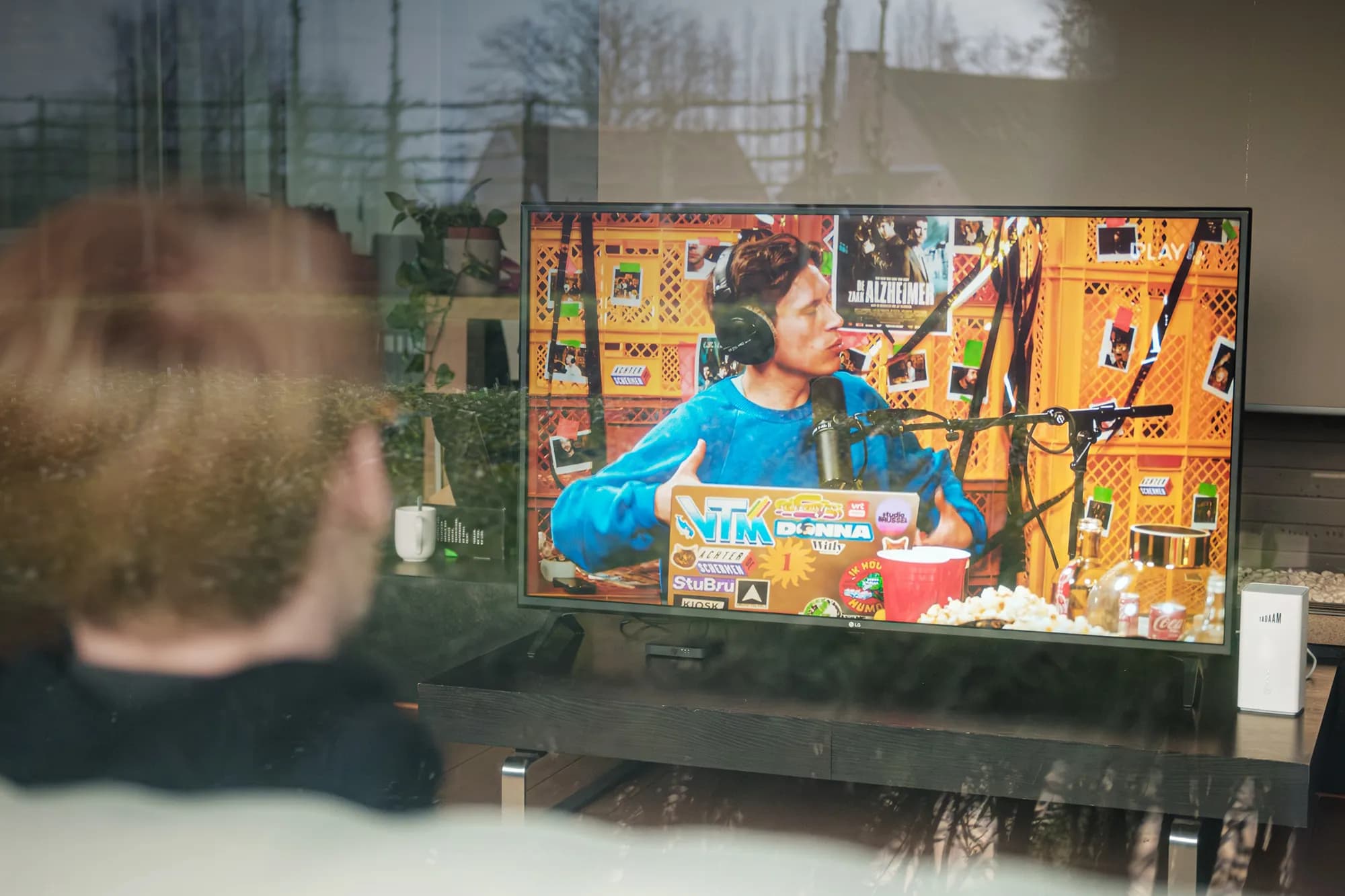 An image of a person watching TV on a smart TV device.