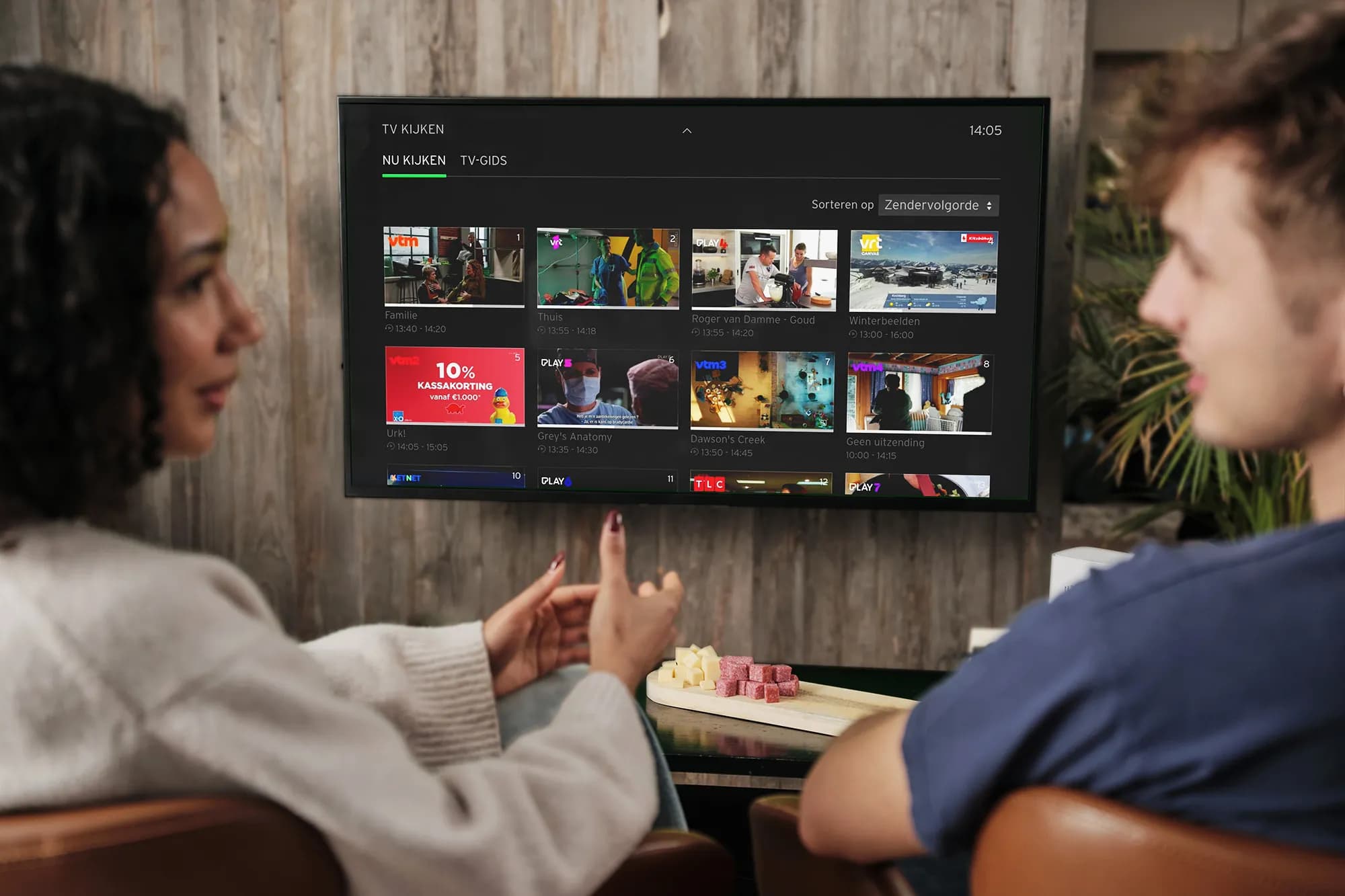 An image of a person watching TV on a smart TV device.